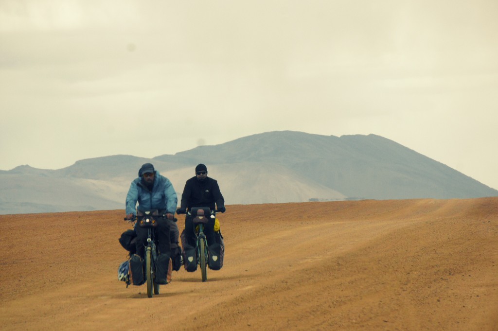 Some random people daring to cross the desert by bike